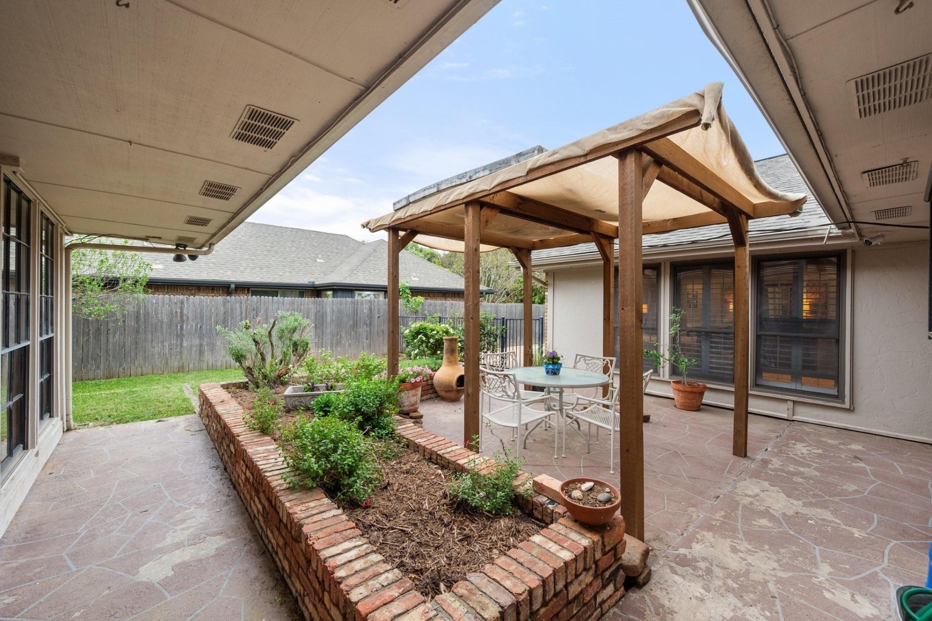 Covered Patio with Pergola & Garden Beds